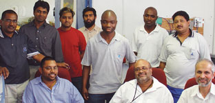 The management of Autotronix (seated) with some of the team: Rudy Pungavanam (sales manager), Collin Chetty (project manager and a director), Haroon Bassa (project manager and a director)